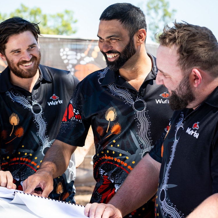 Three Wurrba team members sharing a laugh on site